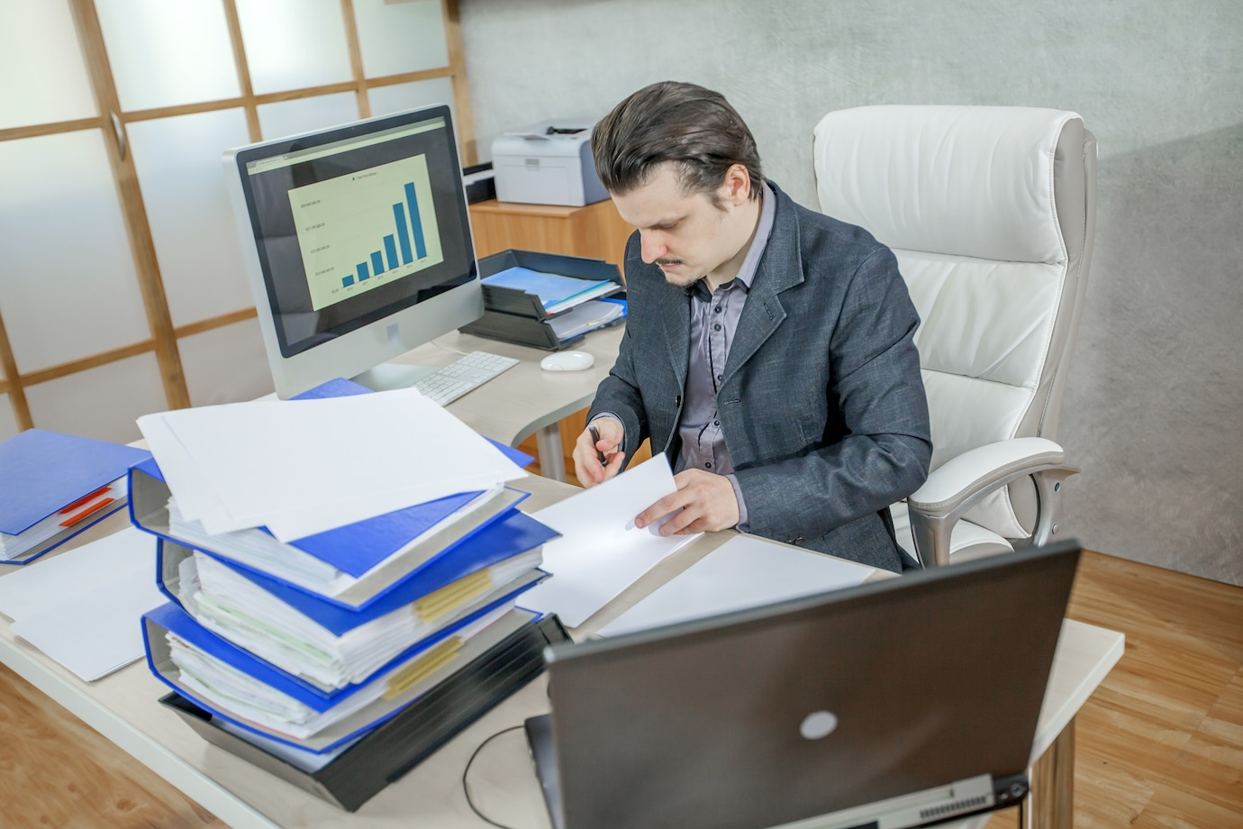 Business owner planning growth at desk